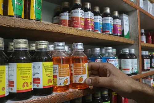an-employee-arranges-cough-syrups-at-a-pharmacy-in-srinagar-jammu-and-kashmir-on-october-6